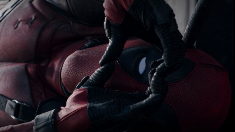 Deadpool making a heart with his hands