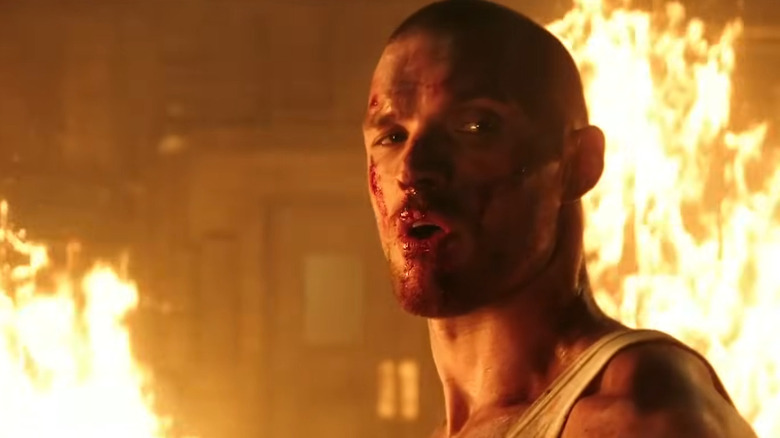 Francis standing in fire