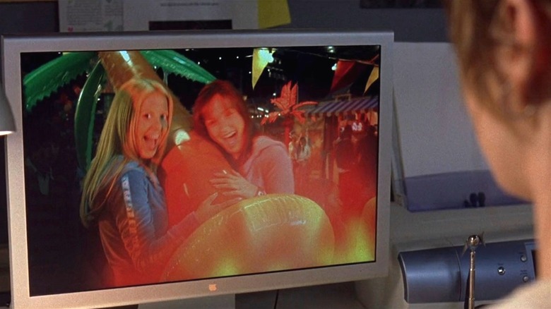 Wendy Christensen looking at a photograph in Final Destination 3