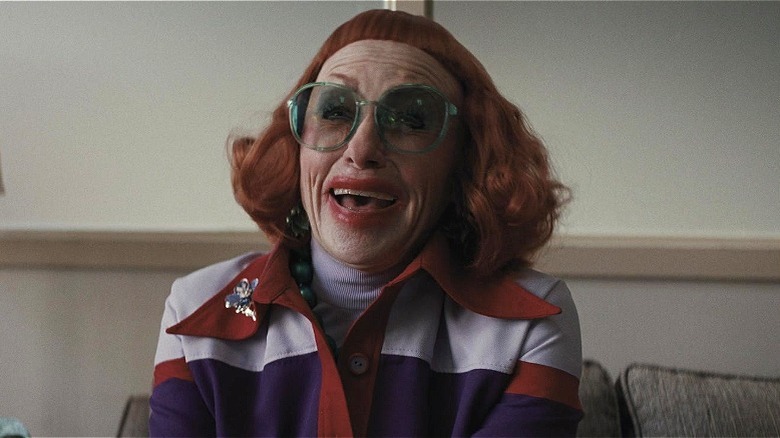 Gladys laughing in the principal's office in "Weapons" (2025)