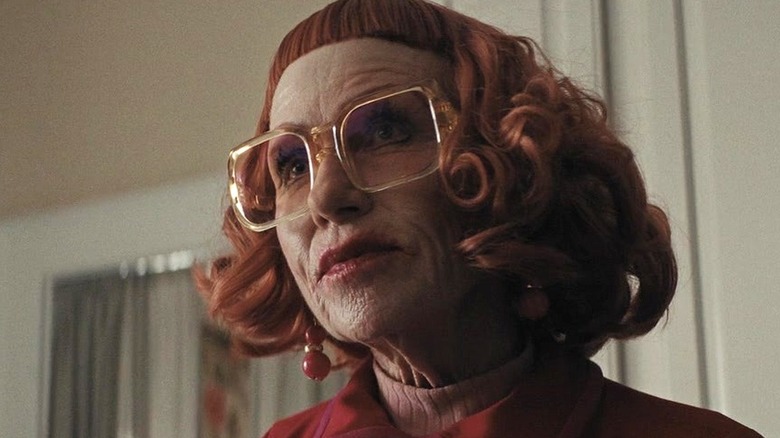 Aunt Gladys standing in the principal's home in "Weapons" (2025)