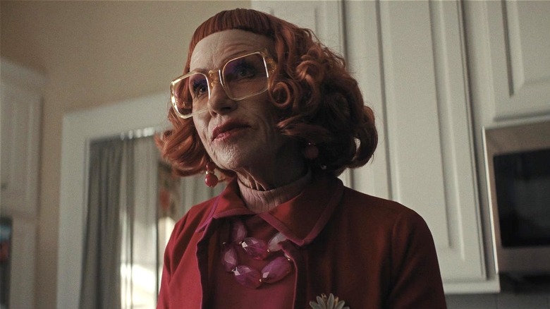 Aunt Gladys standing in the principal's home in Weapons (2025)