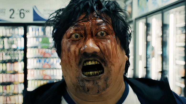 bloodied bug-eyed Marcus runs screaming in a store in "Weapons" (2025)