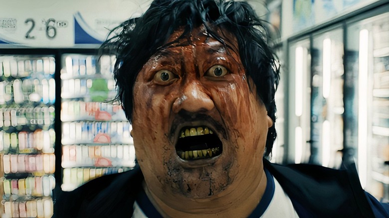 bloodied bug-eyed Marcus runs screaming in a store in 