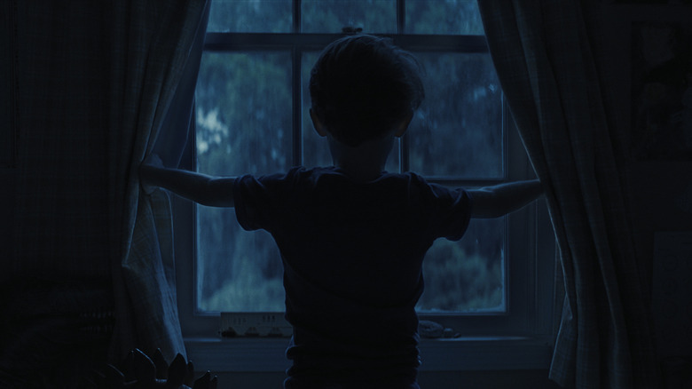 Alex looks out window in Weapons