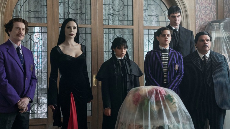 Principal Dort, Morticia, Wednesday, Pugsley, Lurch, and Gomez examining the Gardener's Cottage (2025)