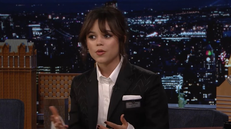 Jenna Ortega talking on the set of The Tonight Show