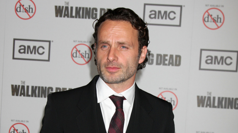 Andrew Lincoln wearing black suit