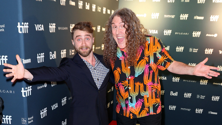 Daniel Radcliffe and "Weird Al" Yankovic posing