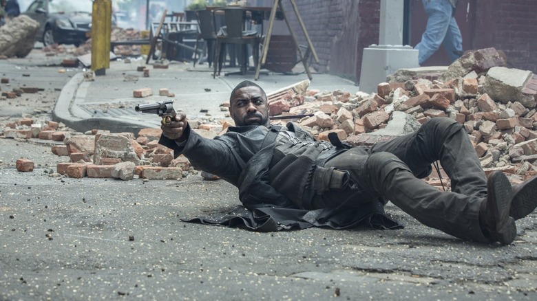 Roland laying on the ground shooting gun