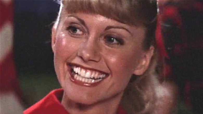 Sandy smiling in Grease