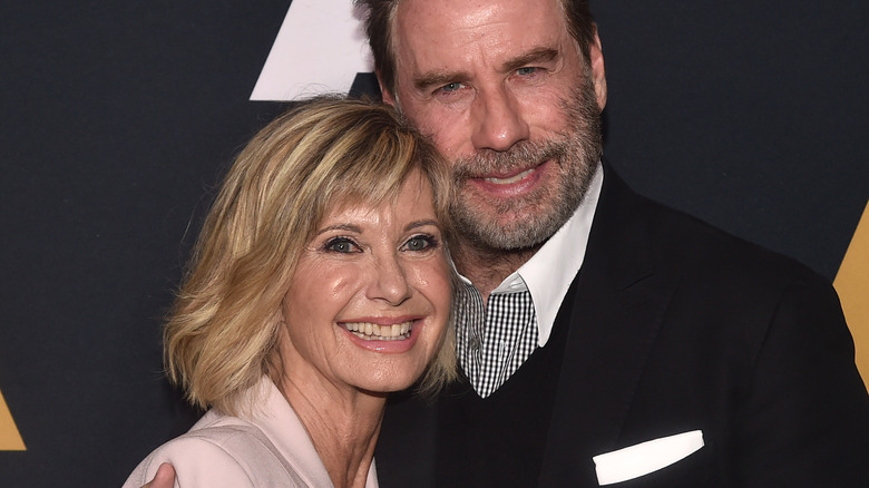 Travolta and Newton-John smiling 