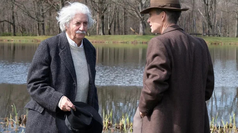 Einstein and Oppenheimer talk by a pond in "Oppenheimer" (2023)