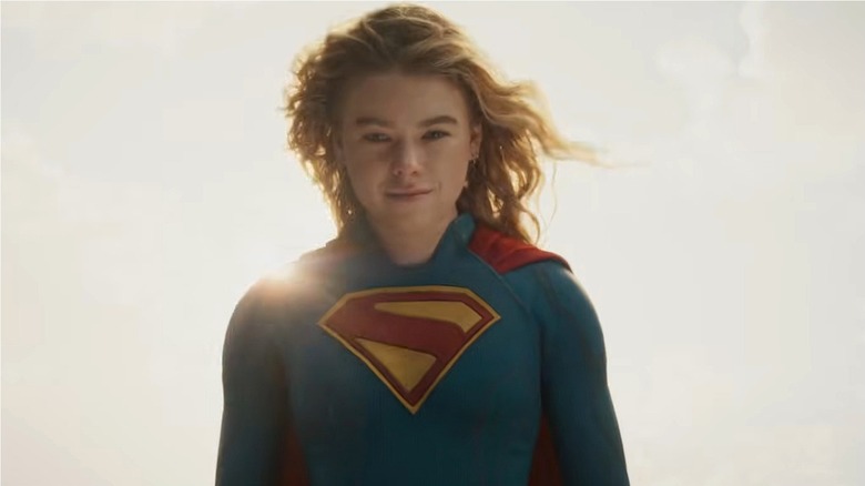 Supergirl smiling against a bright sun in 