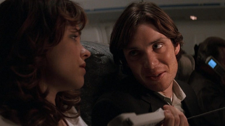 Cillian Murphy hands phone to Rachel McAdams