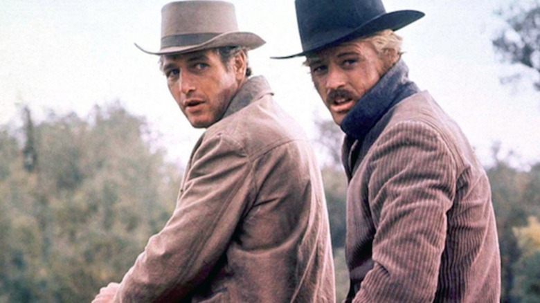 Butch and Sundance riding a horse together in "Butch Cassidy and the Sundance Kid"