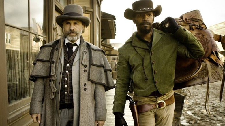 Django and Dr. King walking down the sidewalk together in "Django Unchained"