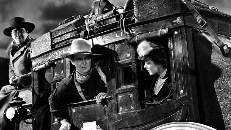 The coach's passengers during their ride in "Stagecoach"
