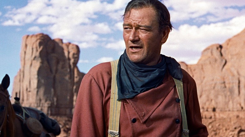 Ethan Edwards standing in the desert in "The Searchers"