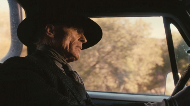 Man in Black driving truck