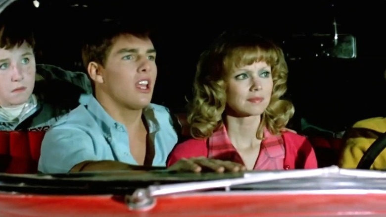 Woody and Kathy sitting in the car