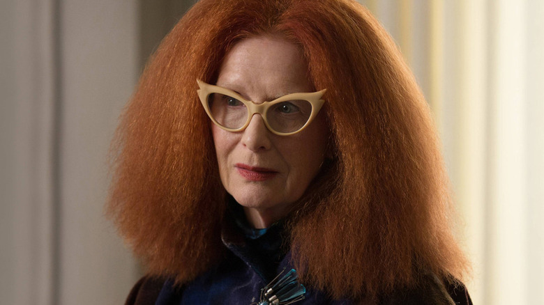 Myrtle Snow wears chic glasses