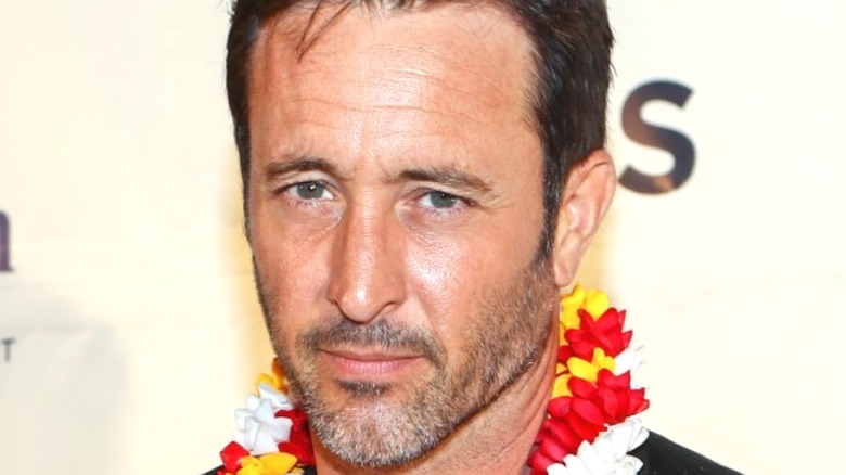 Alex O'Loughlin wears Hawaiian lei