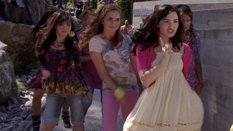 Mitchie, Caitlin, and Ella walking with a purpose