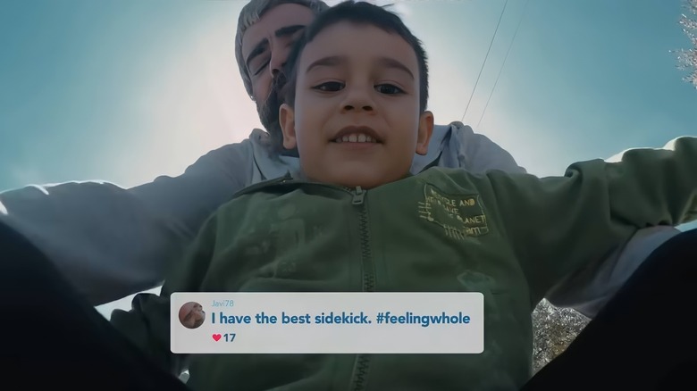 Father sledding with child