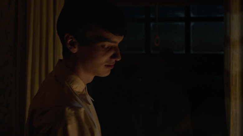 Peter Gordon smiles by the window