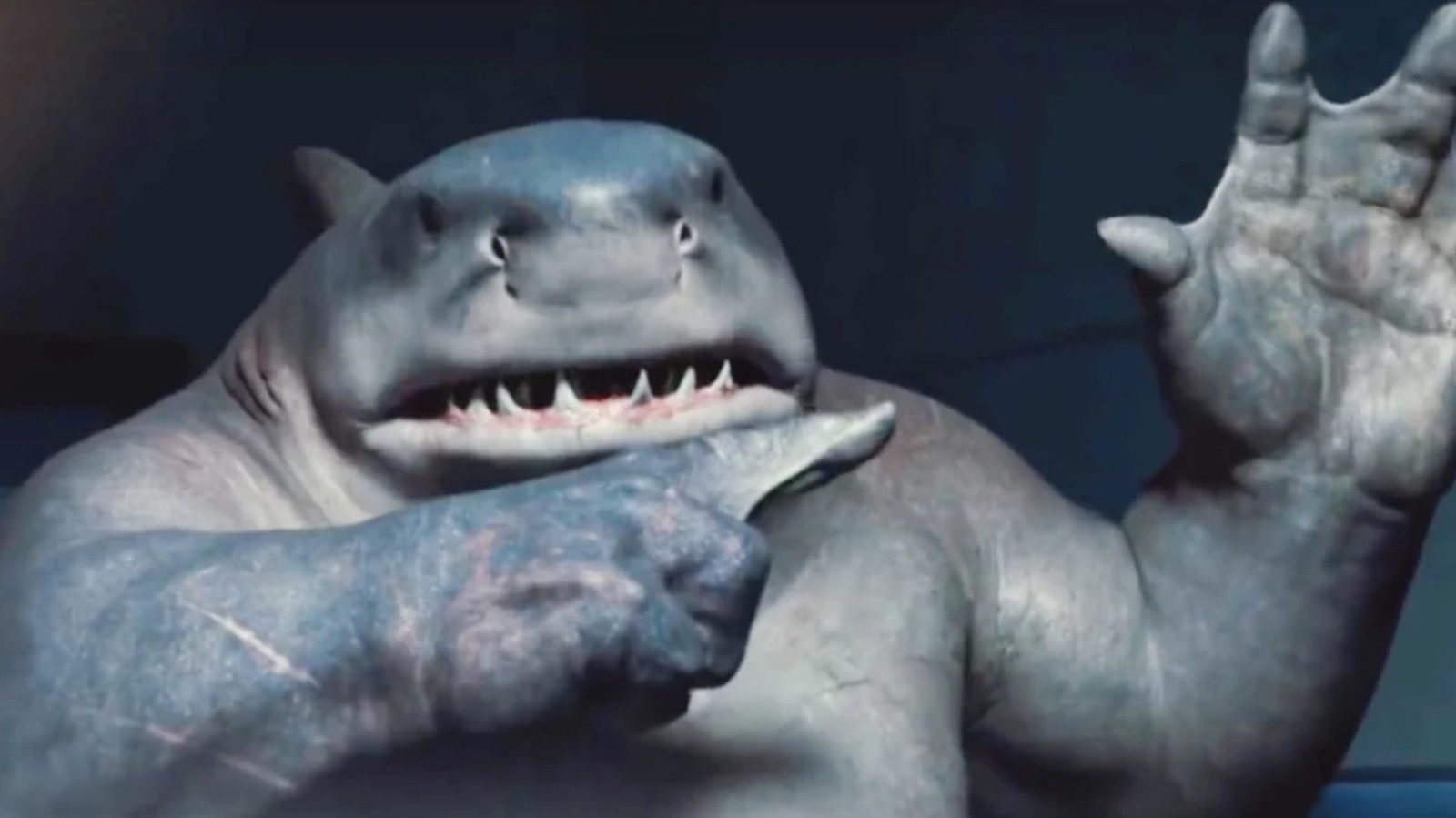 What Book Does King Shark Read Upside Down In The Suicide Squad?