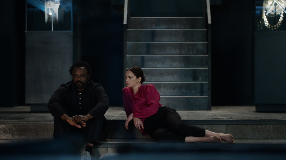 Ariyon Bakare and Ruth Wilson recline on the stairs