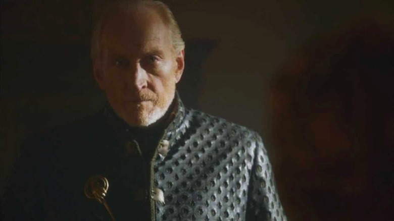 Tywin Lannister in shadowy hallway