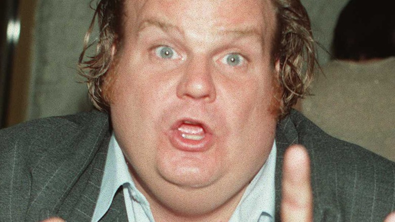 Chris Farley posing at a movie premiere