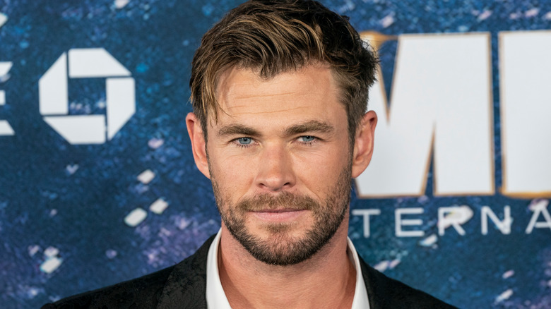 Chris Hemsworth smirks