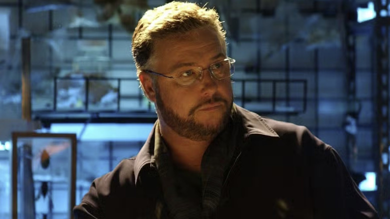 Gil Grissom looking serious while doing research on 