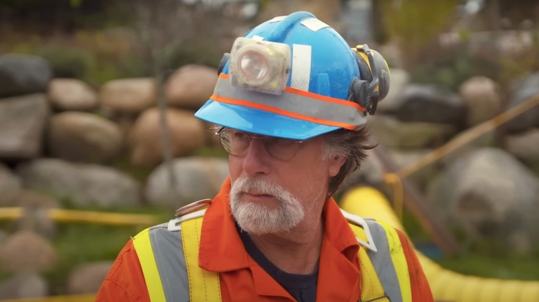 Rick Lagina in a blue helmet. 