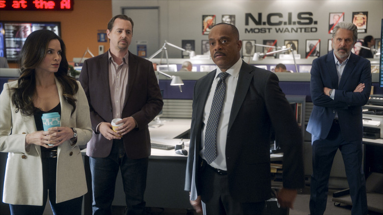 NCIS characters standing in office
