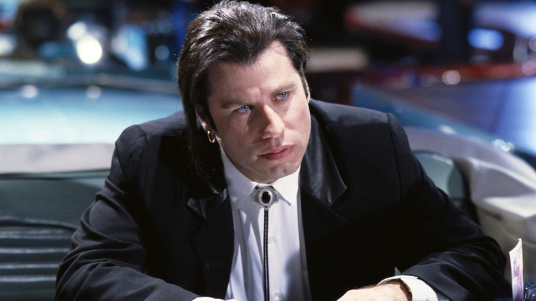 Vince listening to Mia in the diner in Pulp Fiction (1994)