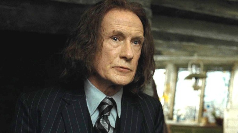 Rufus Scrimgeour in a pinstriped suit with long hair in Harry Potter and the Deathly Hallows - Part 1