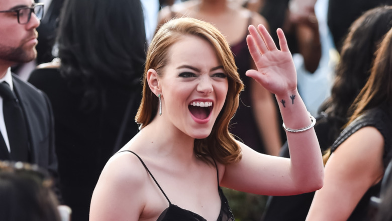 Emma Stone waving