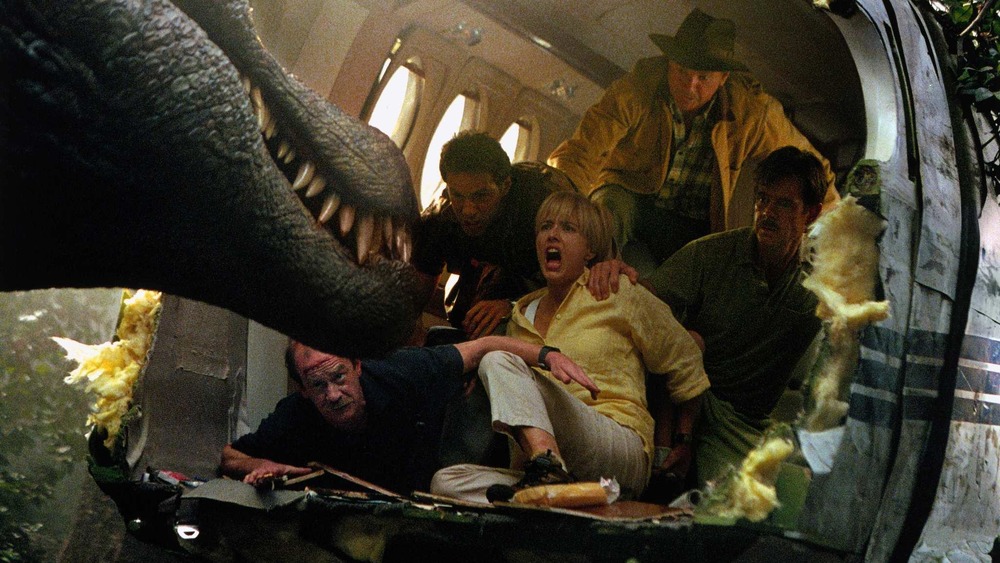 A spinosaurus, Micheal Jeter, Alessandro Nivola, Téa Leoni, Sam Neill, and William H. Macy in Jurassic Park III