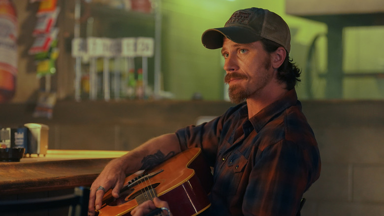 Mitch Keller playing guitar