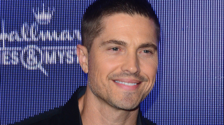 Eric Winter smiling at red carpet event