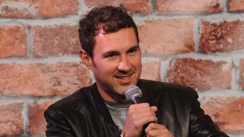 Mark Normand talking into microphone