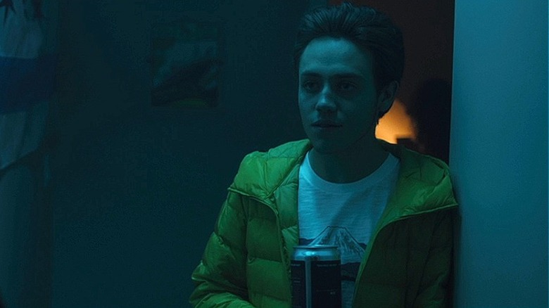 Josh standing in hallway at party in Alex/October