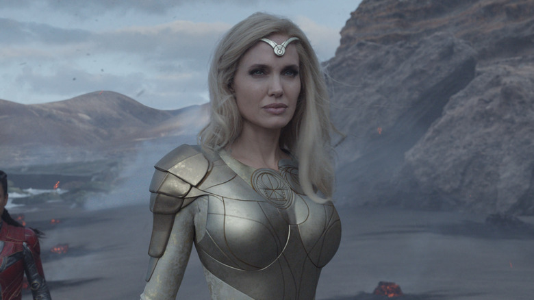 Thena wearing white gold armor