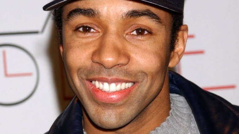 Allen Payne black hat smiling