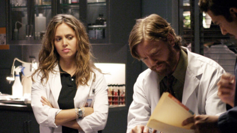 Tru looks over a body