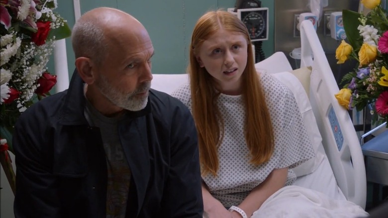 Emily Fornell in hospital bed with dad
